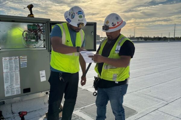 BAS technicians with open panel
